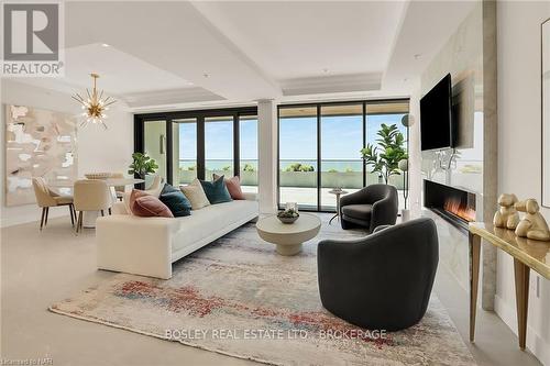 201 - 3823 Terrace Lane, Fort Erie (337 - Crystal Beach), ON - Indoor Photo Showing Living Room With Fireplace