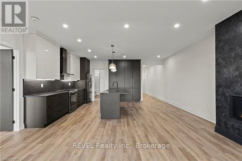 97 Port Robinson Road, Pelham (662 - Fonthill), ON - Indoor Photo Showing Kitchen With Fireplace