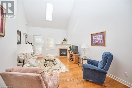 10 - 8142 Costabile Drive, Niagara Falls (213 - Ascot), ON - Indoor Photo Showing Living Room With Fireplace