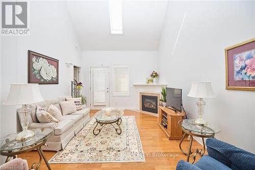 10 - 8142 Costabile Drive, Niagara Falls (213 - Ascot), ON - Indoor Photo Showing Living Room With Fireplace