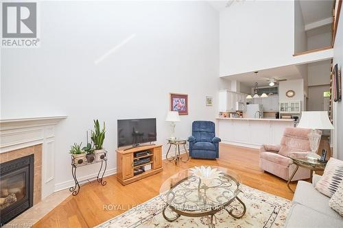 10 - 8142 Costabile Drive, Niagara Falls (213 - Ascot), ON - Indoor Photo Showing Living Room With Fireplace