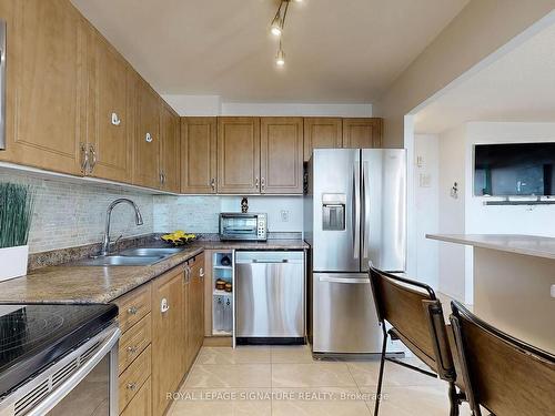 302-530 Lolita Gdns, Mississauga, ON - Indoor Photo Showing Kitchen With Stainless Steel Kitchen With Double Sink