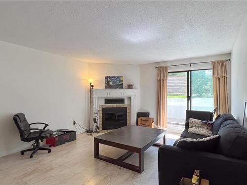 116-290 Regina Ave, Saanich, BC - Indoor Photo Showing Living Room With Fireplace