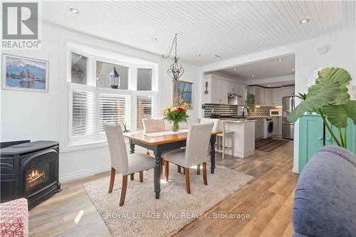 21 Johnston Street, St. Catharines (438 - Port Dalhousie), ON - Indoor Photo Showing Dining Room With Fireplace