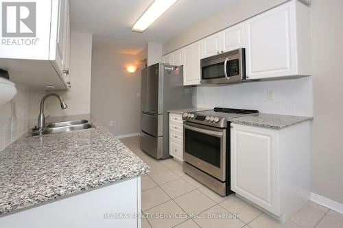 215 - 55 Via Rosedale Avenue, Brampton, ON - Indoor Photo Showing Kitchen With Stainless Steel Kitchen With Double Sink