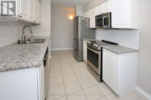 215 - 55 Via Rosedale Avenue, Brampton, ON - Indoor Photo Showing Kitchen With Stainless Steel Kitchen With Double Sink