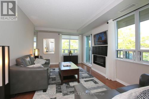 215 - 55 Via Rosedale Avenue, Brampton, ON - Indoor Photo Showing Living Room With Fireplace