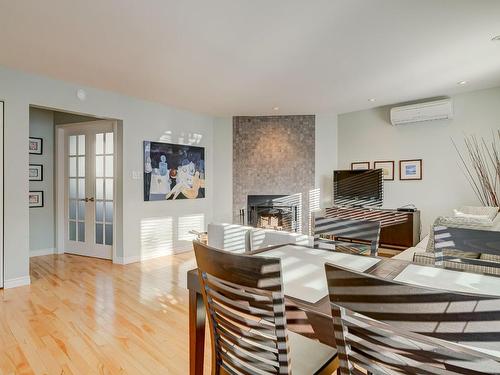 Dining room - 161C Rue Montcalm, Bromont, QC - Indoor With Fireplace