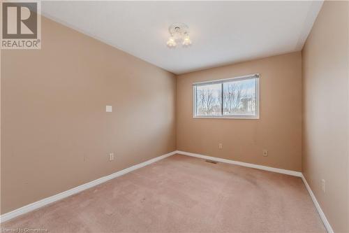 View of carpeted empty room - 10 Fenwick Court, Kitchener, ON 