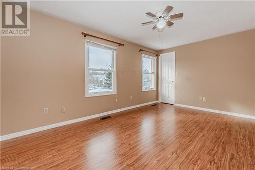 Empty room with ceiling fan and light wood-type flooring - 10 Fenwick Court, Kitchener, ON 