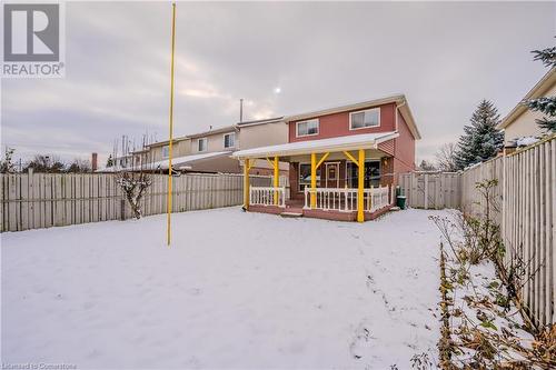 Snow covered house featuring a deck - 10 Fenwick Court, Kitchener, ON 