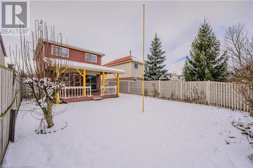 Snow covered house featuring covered porch - 10 Fenwick Court, Kitchener, ON 