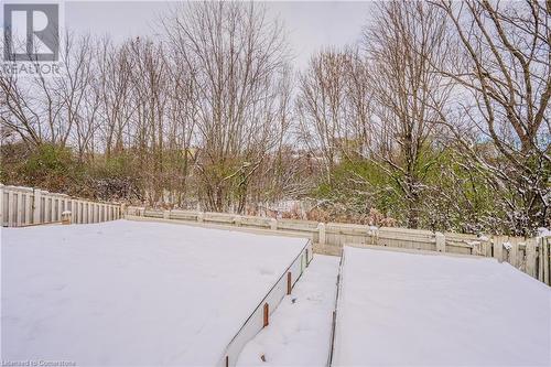 View of yard covered in snow - 10 Fenwick Court, Kitchener, ON 