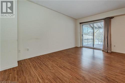 Spare room featuring wood-type flooring - 10 Fenwick Court, Kitchener, ON 