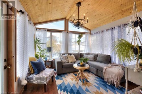 Sunroom with vaulted ceiling with beams, wooden ceiling, and an inviting chandelier - 19 Halifax Drive, Kitchener, ON - Indoor Photo Showing Living Room