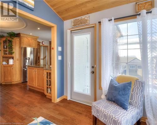 Foyer with wooden ceiling, vaulted ceiling, and dark wood-type flooring - 19 Halifax Drive, Kitchener, ON - Indoor