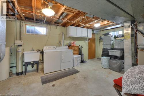 Basement with washing machine and dryer, plenty of natural light, and sink - 19 Halifax Drive, Kitchener, ON - Indoor Photo Showing Laundry Room