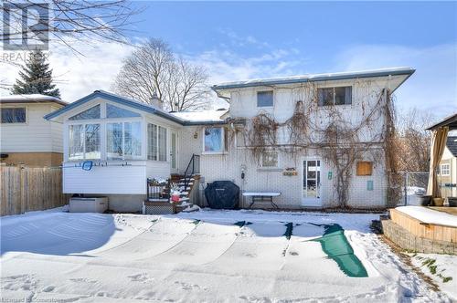 Snow covered house with a sunroom - 19 Halifax Drive, Kitchener, ON - Outdoor With Facade