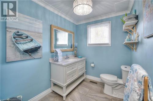 Bathroom featuring ornamental molding, vanity, toilet, and a notable chandelier - 19 Halifax Drive, Kitchener, ON - Indoor Photo Showing Bathroom