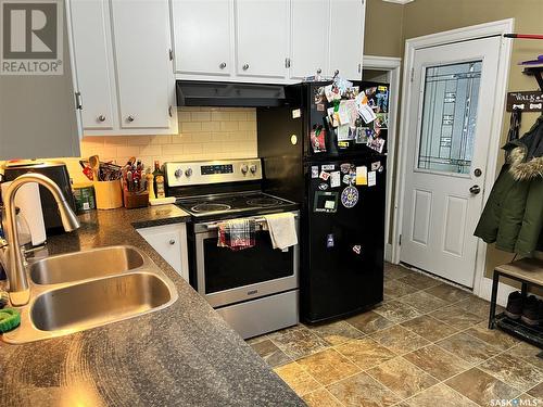 810 28Th Street W, Saskatoon, SK - Indoor Photo Showing Kitchen With Double Sink