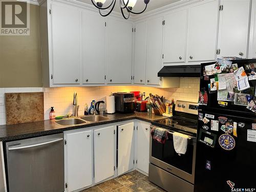 810 28Th Street W, Saskatoon, SK - Indoor Photo Showing Kitchen With Double Sink