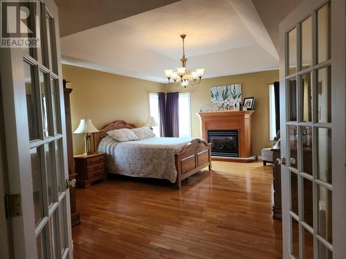 50 Fowlow Drive, Stephenville, NL - Indoor Photo Showing Bedroom With Fireplace