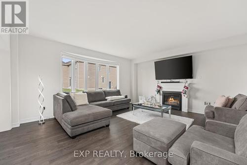 113 Rugman Crescent, Springwater, ON - Indoor Photo Showing Living Room With Fireplace