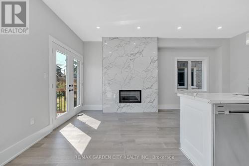 86 Beland Avenue N, Hamilton, ON - Indoor Photo Showing Living Room With Fireplace