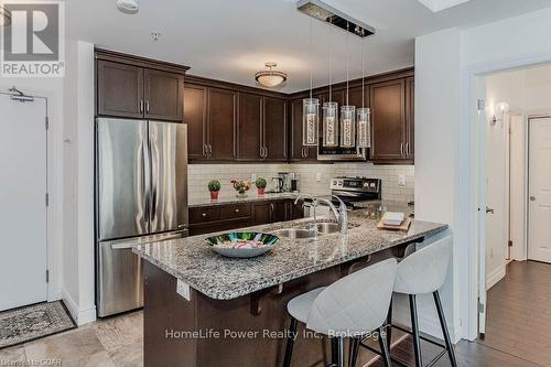 319 - 106 Bard Boulevard, Guelph (Pine Ridge), ON - Indoor Photo Showing Kitchen With Stainless Steel Kitchen With Double Sink With Upgraded Kitchen