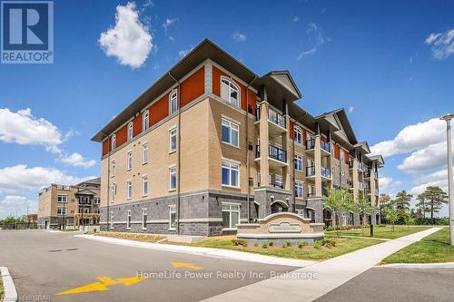 319 - 106 Bard Boulevard, Guelph (Pine Ridge), ON - Outdoor With Balcony With Facade