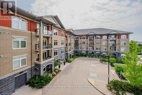 319 - 106 Bard Boulevard, Guelph (Pine Ridge), ON - Outdoor With Balcony With Facade