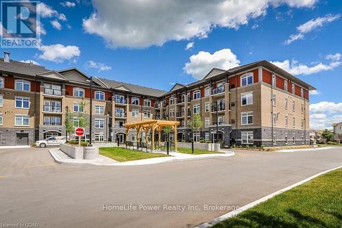 319 - 106 Bard Boulevard, Guelph (Pine Ridge), ON - Outdoor With Balcony With Facade