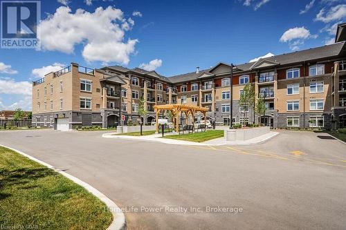 319 - 106 Bard Boulevard, Guelph (Pine Ridge), ON - Outdoor With Balcony With Facade