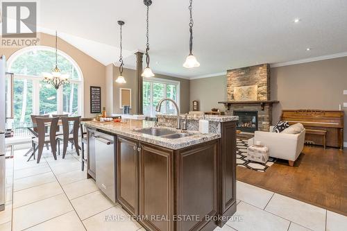 16 Boothby Crescent, Springwater, ON - Indoor Photo Showing Kitchen With Fireplace With Double Sink