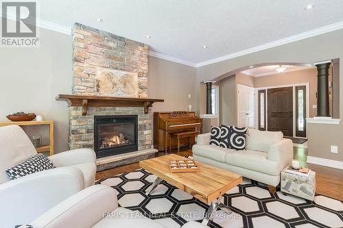 16 Boothby Crescent, Springwater, ON - Indoor Photo Showing Living Room With Fireplace