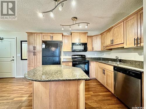 B307 103 Wellman Crescent, Saskatoon, SK - Indoor Photo Showing Kitchen With Double Sink