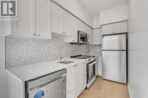 102 - 16 Dallimore Circle, Toronto, ON - Indoor Photo Showing Kitchen With Upgraded Kitchen