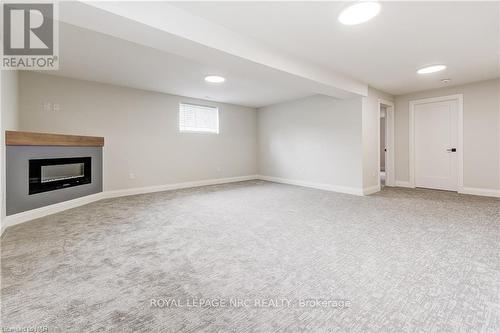 64 Hickory Court, Port Colborne, ON - Indoor Photo Showing Other Room With Fireplace