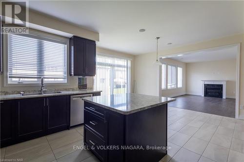 9462 Tallgrass Avenue, Niagara Falls (224 - Lyons Creek), ON - Indoor Photo Showing Kitchen With Fireplace With Double Sink