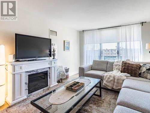 1605 - 820 Burnhamthorpe Road, Toronto, ON - Indoor Photo Showing Living Room With Fireplace