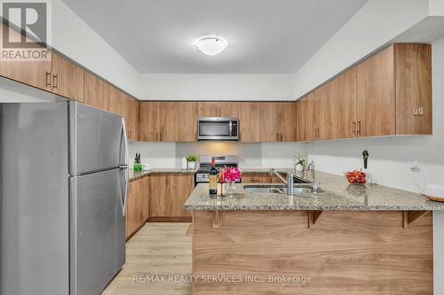 2 - 18 Humberwood Boulevard, Toronto, ON - Indoor Photo Showing Kitchen With Double Sink