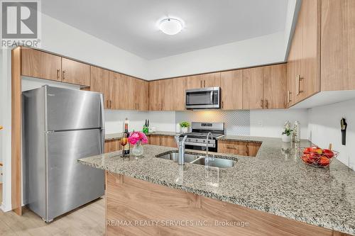 2 - 18 Humberwood Boulevard, Toronto, ON - Indoor Photo Showing Kitchen With Stainless Steel Kitchen With Double Sink