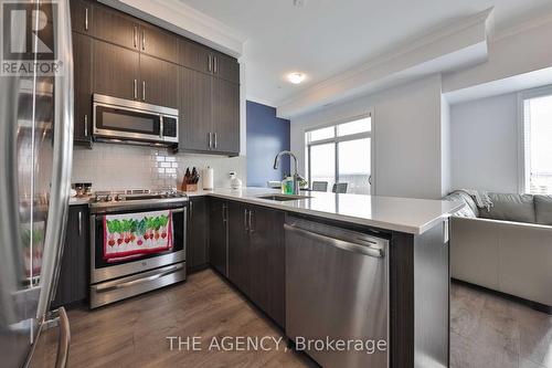 609 - 1105 Leger Way, Milton, ON - Indoor Photo Showing Kitchen With Stainless Steel Kitchen With Upgraded Kitchen