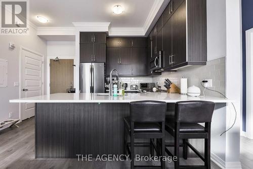 609 - 1105 Leger Way, Milton, ON - Indoor Photo Showing Kitchen With Stainless Steel Kitchen With Upgraded Kitchen