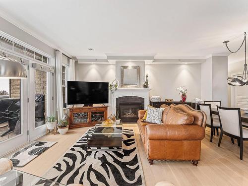 Salon - 403-60 Rue Du Lac, Magog, QC - Indoor Photo Showing Living Room With Fireplace