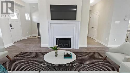 13 South Coast Circle, Fort Erie (337 - Crystal Beach), ON - Indoor Photo Showing Living Room With Fireplace