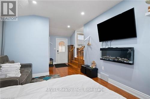 7229 Harriman Street, Niagara Falls (207 - Casey), ON - Indoor Photo Showing Bedroom With Fireplace