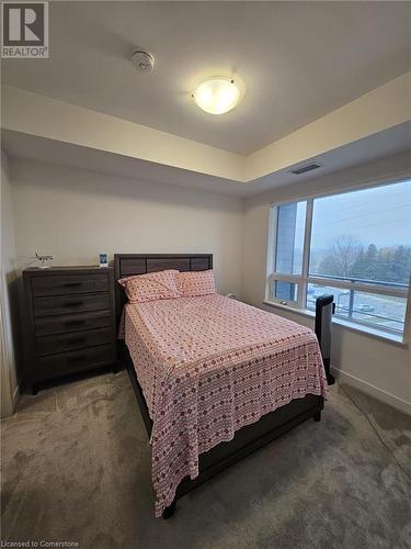 Bedroom with carpet - 251 Northfield Drive E Unit# 401, Waterloo, ON - Indoor Photo Showing Bedroom