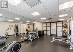 Gym featuring a paneled ceiling - 