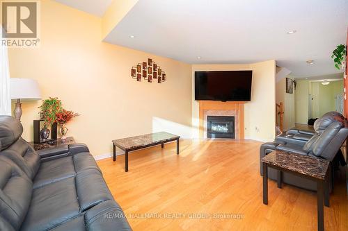 213 Duntroon Circle N, Ottawa, ON - Indoor Photo Showing Living Room With Fireplace